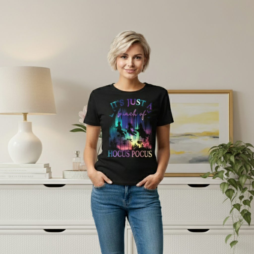 Woman wearing a black t-shirt with colorful text in a living room setting