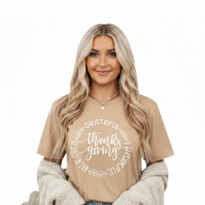 Woman wearing a beige t-shirt with text on a white background