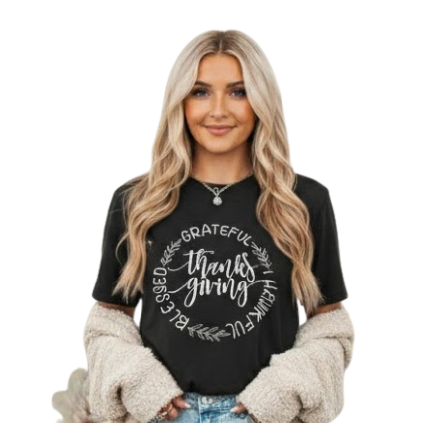 Woman wearing a black t-shirt with text, standing against a white background